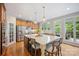 Gourmet kitchen with large island, stainless steel appliances, custom cabinets, and backyard access at 184 Melbourne Dr, Fort Mill, SC 29708