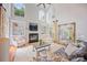 Spacious living room with high ceilings, fireplace, built-in shelves, and large windows at 184 Melbourne Dr, Fort Mill, SC 29708