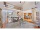 Elegant living room with hardwood floors, staircase, open layout, and view of the kitchen at 184 Melbourne Dr, Fort Mill, SC 29708