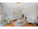 Cozy living room featuring hardwood floors, comfortable seating, and neutral decor at 184 Melbourne Dr, Fort Mill, SC 29708