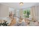 Inviting living room with hardwood floors, large window, comfortable seating, and beautiful staircase at 184 Melbourne Dr, Fort Mill, SC 29708