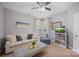 Cozy living room with comfortable seating, decor, and a well-lit aquarium on a shelving unit at 184 Melbourne Dr, Fort Mill, SC 29708