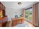 Bright home office featuring wood floors, built in cabinet, large window, and wood desk at 184 Melbourne Dr, Fort Mill, SC 29708