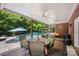 Covered patio features ceiling fans, dining area, and a view of the backyard swimming pool at 184 Melbourne Dr, Fort Mill, SC 29708