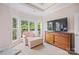 A bedroom sitting area provides a TV and backyard views at 184 Melbourne Dr, Fort Mill, SC 29708