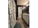 Bathroom featuring a shower, vanity with dual sinks, and dark accent wall at 1916 Country Way, Hickory, NC 28601