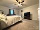 Spacious main bedroom with bed, tv, and a sitting area at 1916 Country Way, Hickory, NC 28601