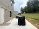 Inviting outdoor patio with grill, perfect for enjoying backyard views at 1916 Country Way, Hickory, NC 28601