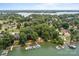 Breathtaking lakefront property featuring private dock and boat slips amidst lush greenery at 200 Southwood Park Rd, Mooresville, NC 28117