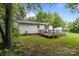 Spacious backyard featuring a wooden deck and mature trees at 200 Southwood Park Rd, Mooresville, NC 28117
