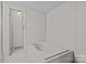 Bright bathroom featuring a tub and neutral panelling throughout at 200 Southwood Park Rd, Mooresville, NC 28117