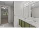 Bathroom with dual sink vanity, mirrors, and shower at 200 Southwood Park Rd, Mooresville, NC 28117