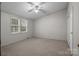 Bedroom with carpet, a window, and light neutral walls and ceiling fan at 200 Southwood Park Rd, Mooresville, NC 28117