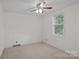 Bedroom featuring light neutral walls, carpet, and a window providing natural light at 200 Southwood Park Rd, Mooresville, NC 28117