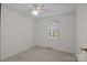 Bedroom with carpet, a window, and light neutral walls at 200 Southwood Park Rd, Mooresville, NC 28117