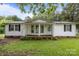 Charming one story home featuring a covered porch and inviting curb appeal at 200 Southwood Park Rd, Mooresville, NC 28117