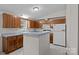 Functional kitchen featuring wooden cabinets, a center island, and plenty of countertop space at 200 Southwood Park Rd, Mooresville, NC 28117