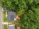 Aerial view of the property highlighting the home, deck, yard, and mature trees at 2005 Scott Ave, Charlotte, NC 28203