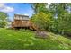 Large wooden deck perfect for outdoor living and overlooking the expansive backyard at 2005 Scott Ave, Charlotte, NC 28203