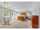 Spacious bedroom with ample natural light, and a decorative furniture set at 2005 Scott Ave, Charlotte, NC 28203