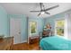 Charming bedroom features hardwood floors, a ceiling fan, and natural light from windows at 2005 Scott Ave, Charlotte, NC 28203