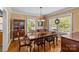 Formal dining room with classic furniture, hardwood floors, and abundant natural light at 2005 Scott Ave, Charlotte, NC 28203