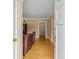 Inviting entryway with hardwood floors, textured walls, and view into the living space at 2005 Scott Ave, Charlotte, NC 28203