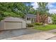 Brick home with detached garage, showcasing the driveway, landscaping, and architectural style at 2005 Scott Ave, Charlotte, NC 28203