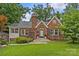 Charming brick home with well-maintained lawn, classic architectural details, and inviting entrance at 2005 Scott Ave, Charlotte, NC 28203