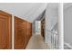 Hallway with built-in cabinets, carpet, and a view to a window at 2005 Scott Ave, Charlotte, NC 28203