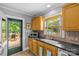 Kitchen featuring countertops, sink, and access to the back deck at 2005 Scott Ave, Charlotte, NC 28203