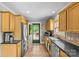 Well-lit kitchen with stainless steel appliances and access to outdoor deck at 2005 Scott Ave, Charlotte, NC 28203