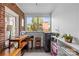 Bright office space showcasing exposed brick, large window, and functional layout at 2005 Scott Ave, Charlotte, NC 28203