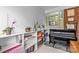 Bright office space featuring white built-in shelving, large window, and piano at 2005 Scott Ave, Charlotte, NC 28203