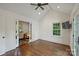 Open bonus room with high ceilings, hardwood floors, lots of natural light, and an adjacent office area at 2011 Fromby Ct, Charlotte, NC 28211