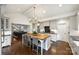 Open kitchen with a large island, modern appliances, and seamless access to living areas at 2011 Fromby Ct, Charlotte, NC 28211
