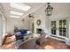 Outdoor living area with a brick fireplace, comfortable seating, and overhead lighting at 2011 Fromby Ct, Charlotte, NC 28211