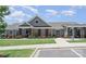 Beautiful clubhouse with well-manicured landscaping, ample parking and elegant design at 205 Falls Cove Dr, Troutman, NC 28166