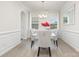 Bright dining room with gray chairs, pendant lighting, and elegant wall trim at 205 Falls Cove Dr, Troutman, NC 28166
