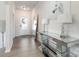 Inviting foyer featuring a decorative table, mirror, and elegant lighting fixtures at 205 Falls Cove Dr, Troutman, NC 28166