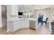 Bright kitchen with white cabinetry, stainless steel dishwasher, and view into the dining area at 205 Falls Cove Dr, Troutman, NC 28166