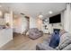 Cozy living room featuring a fireplace, large windows, and comfortable seating at 205 Falls Cove Dr, Troutman, NC 28166