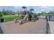 Community playground with slides, climbing structure, and safety surfacing for active play at 205 Falls Cove Dr, Troutman, NC 28166