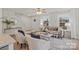 Bright living room with two armchairs, statement throw pillows, and windows that let in natural light at 207 Putnam St, Shelby, NC 28152