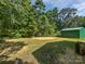 Spacious backyard view shows mature trees and a utility shed at 232 Branchwood Cir, Kings Mountain, NC 28086