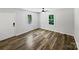 Cozy bedroom with wood-look flooring, bright windows, and neutral decor to allow personalization at 232 Branchwood Cir, Kings Mountain, NC 28086