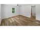 This bright bedroom features hardwood floors, a ceiling fan, and natural light from the window at 232 Branchwood Cir, Kings Mountain, NC 28086