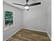 A cozy bedroom features hardwood floors, a ceiling fan, and lots of natural light at 232 Branchwood Cir, Kings Mountain, NC 28086