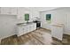 Well-lit kitchen featuring white cabinets, stainless steel appliances, and plenty of counter space at 232 Branchwood Cir, Kings Mountain, NC 28086