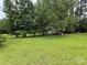 Backyard features a dense grouping of trees and lush greenery at 2350 Grubb Ferry Rd, Salisbury, NC 28144